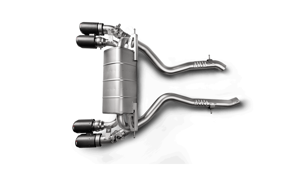 Aerial view of an Akrapovic titanium exhaust system with quad tips for a BMW M2 F87N