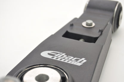 Close up view of a black Eibach adjustable camber lower arms showing the central bush & end bush