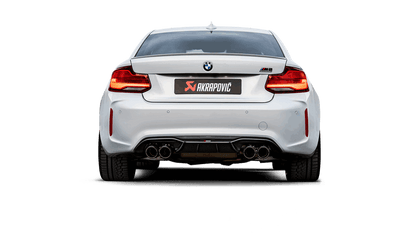 Rear view of a white BMW M2 Competition F87N with Akrapovic exhaust, with quad carbon fibre tips, fitted