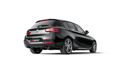 Rear three-quarter view of a black BMW M140i with Akrapovič exhaust fitted