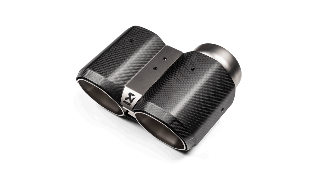 Close up view of a pair of Akrapovic exhaust tail pipe tips in carbon fibre with an octagonal end