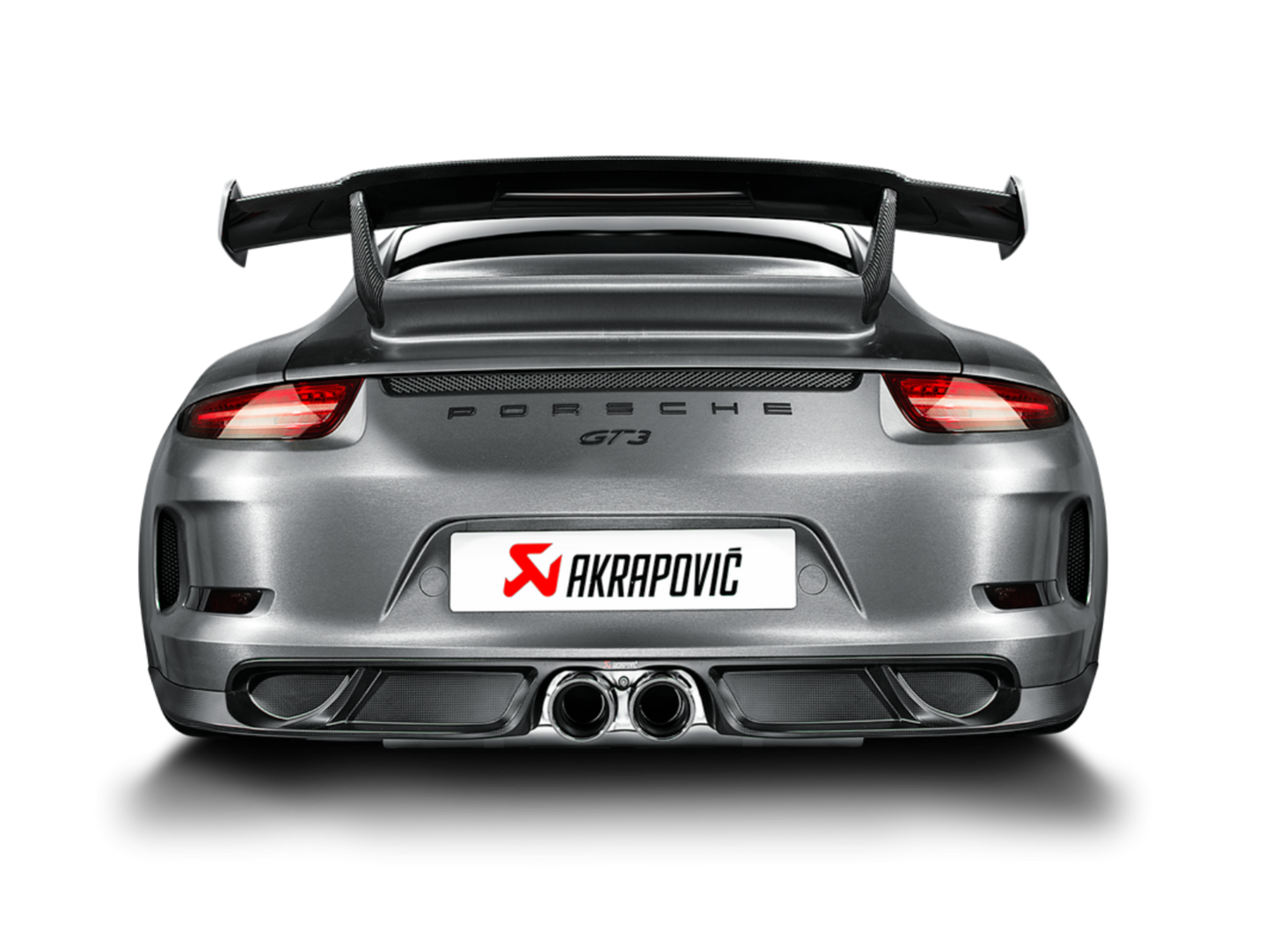 Rear view of a silver/grey Porsche GT3 with an Akrapovič twin pipe exhaust & rear carbon fibre diffuser fitted