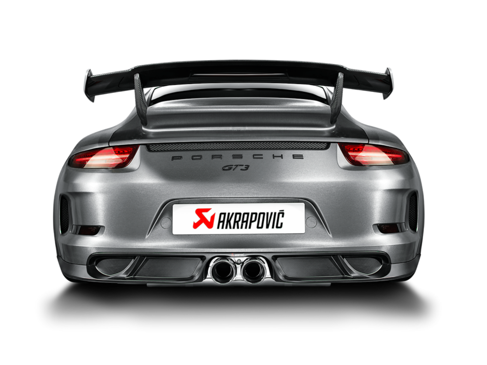 Rear view of a silver/grey Porsche GT3 with an Akrapovič twin pipe exhaust & rear carbon fibre diffuser fitted