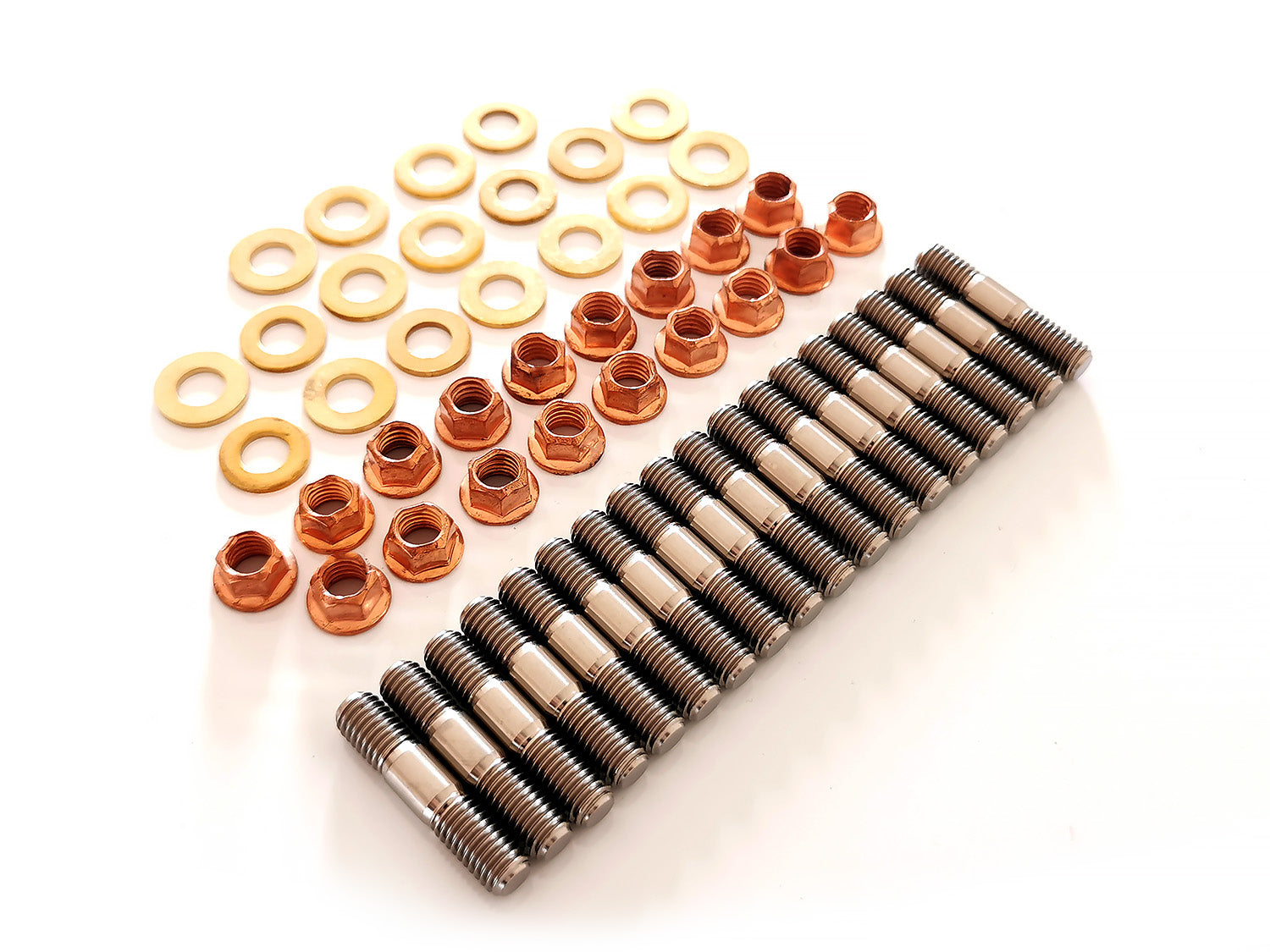 An aerial view of a STG Titanium exhaust manifold stud kit which includes 18 Titanium studs, 18 hex copper K-nuts & 18 brass washers