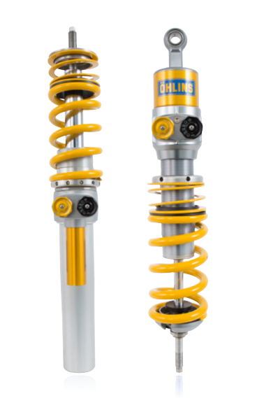 Front view of a pair Öhlins racing coil overs with distinctive gold and yellow coloring, yellow coil springs attached with adjustable dials