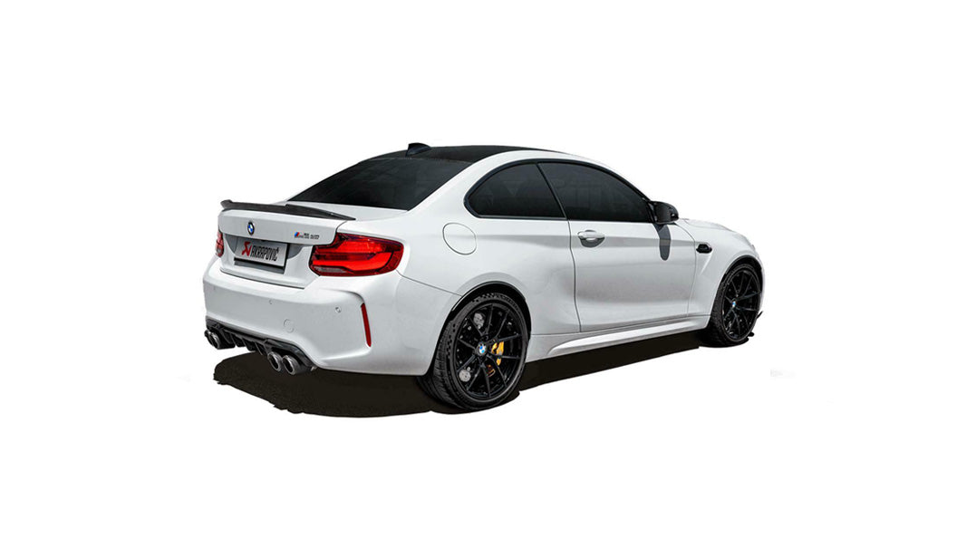 Offside rear view of a white BMW M2 with an Akrapovic exhaust system, with twin carbon fibre tips each side, fitted