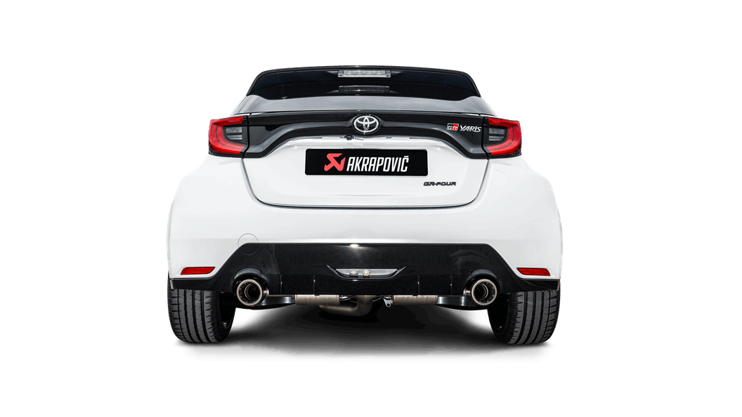 Rear view of a white Toyota GR Yaris with an Akrapovič exhaust, with a pipe each side, fitted