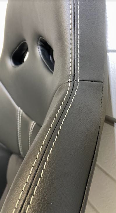 Close up view of the white stitching on the black Cobra Nogaro Circuit seat